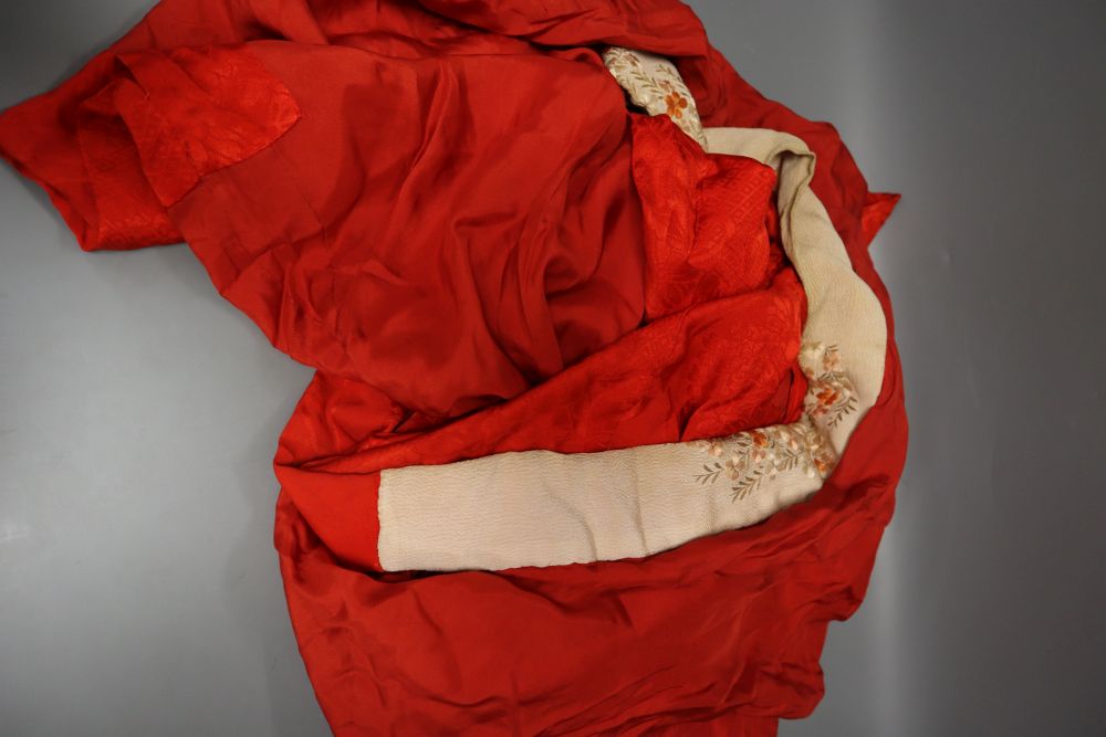 A silk crepe reversible Japanese kimono, a red silk damask with embroidered edge kimono, a black crepe de chine jacket kimono
